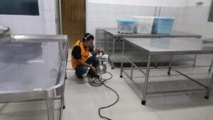 Pest control technologist in Bacolod inspecting equipment in a sterile treatment facility
